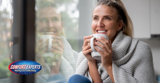 Woman sitting near window.