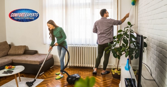 Woman and man cleaning.